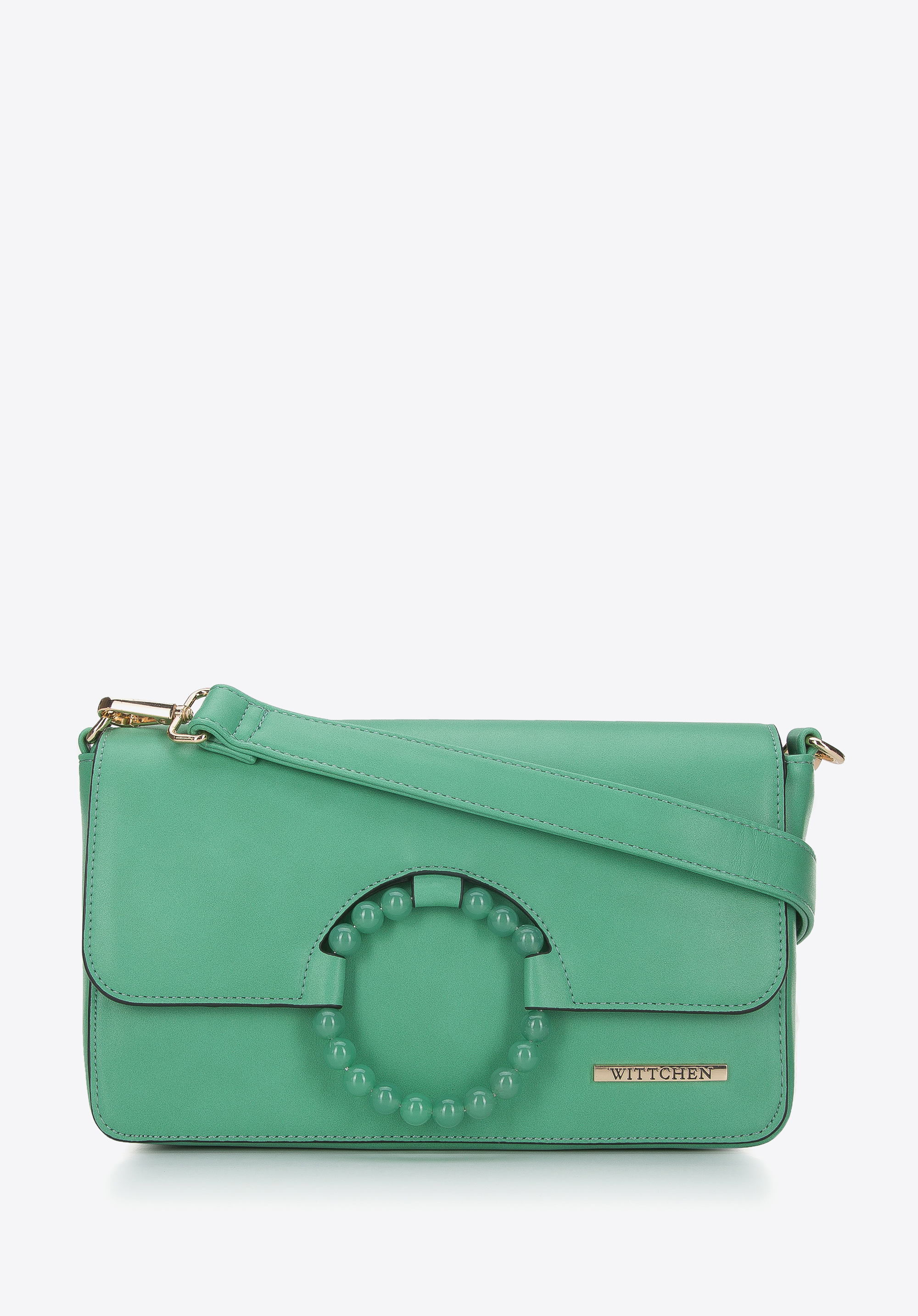 Damenhandtasche mit Ring auf der Klappe