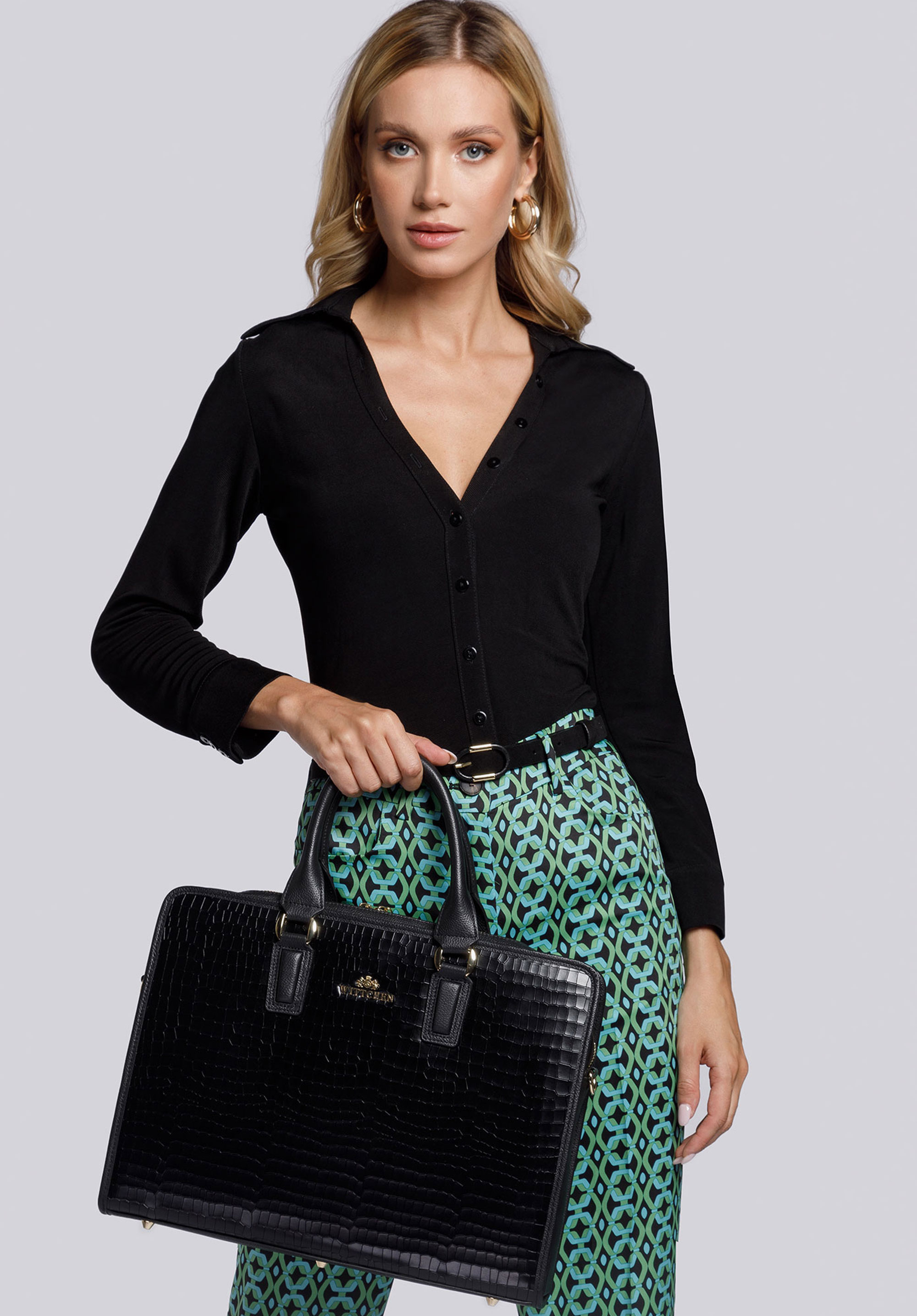 Laptoptasche für Damen aus Leder mit Standfüßen aus Metall