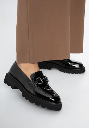 Patent leather loafers with glistening buckle