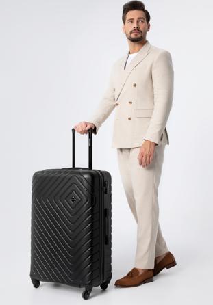 Large suitcase with geometric design