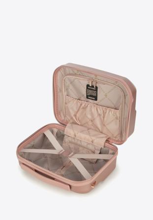 Polycarbonate travel case with a rose gold zipper
