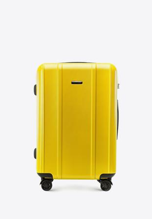 Średnia walizka z polikarbonu z pionowymi tłoczeniami żółta